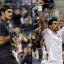 djokovic raising his hands victorious against federer