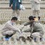 japanese checking radiation in a ricefield