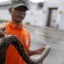local thailand resident caught snake in the floodwaters