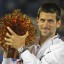novak djokovic recives trophy after winning abu dhabi exhibition tournament