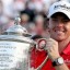 rory mcilroy receives his trophy after winning us pga championship